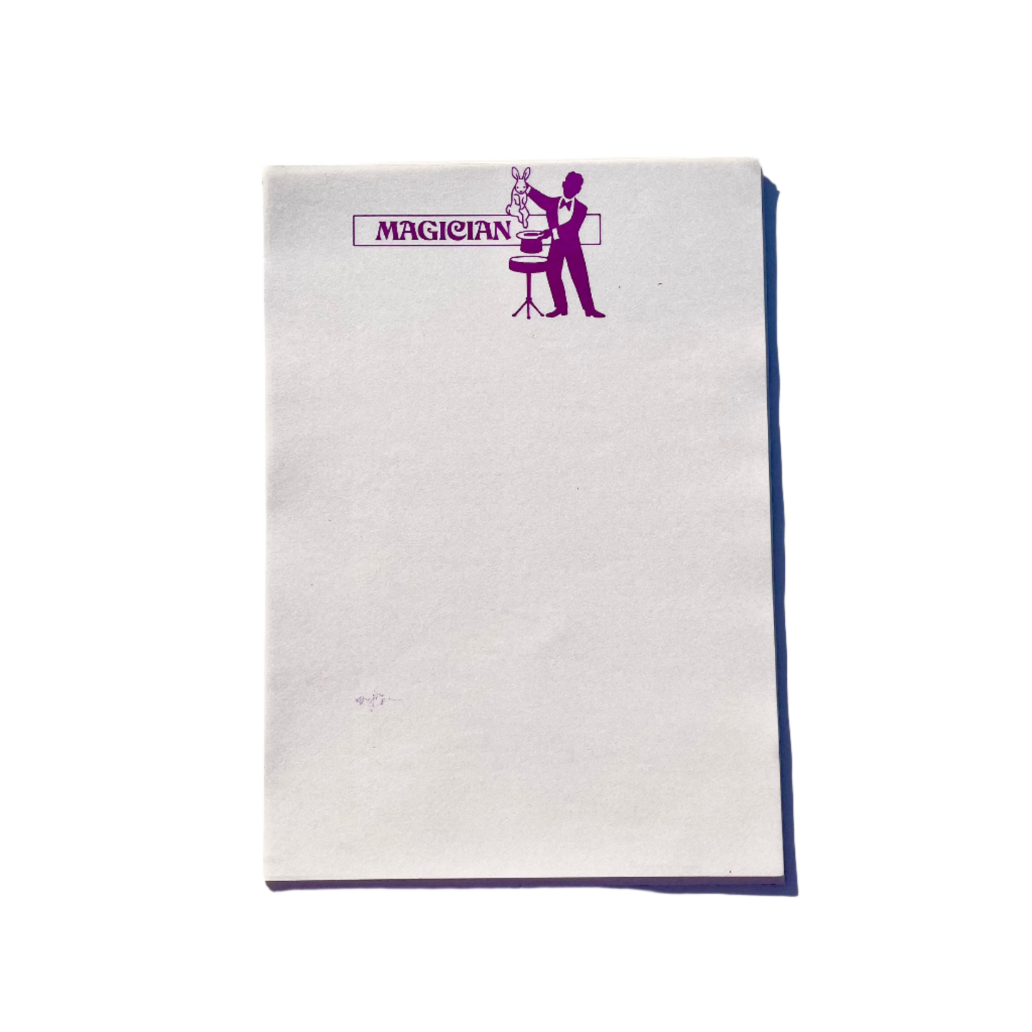 Sheets of white writing paper with a purple print of a magician at the top, titled 'MAGICIAN' beside the illustration.