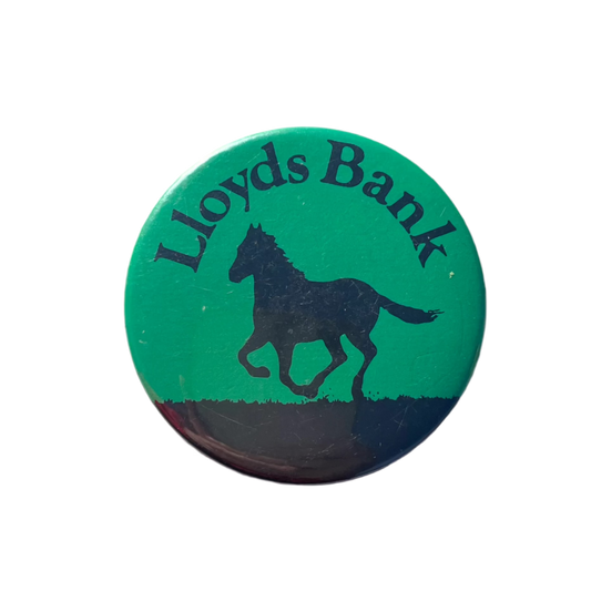 A round green badge with the text 'Lloyds Bank' and a silhouette of a horse on it.