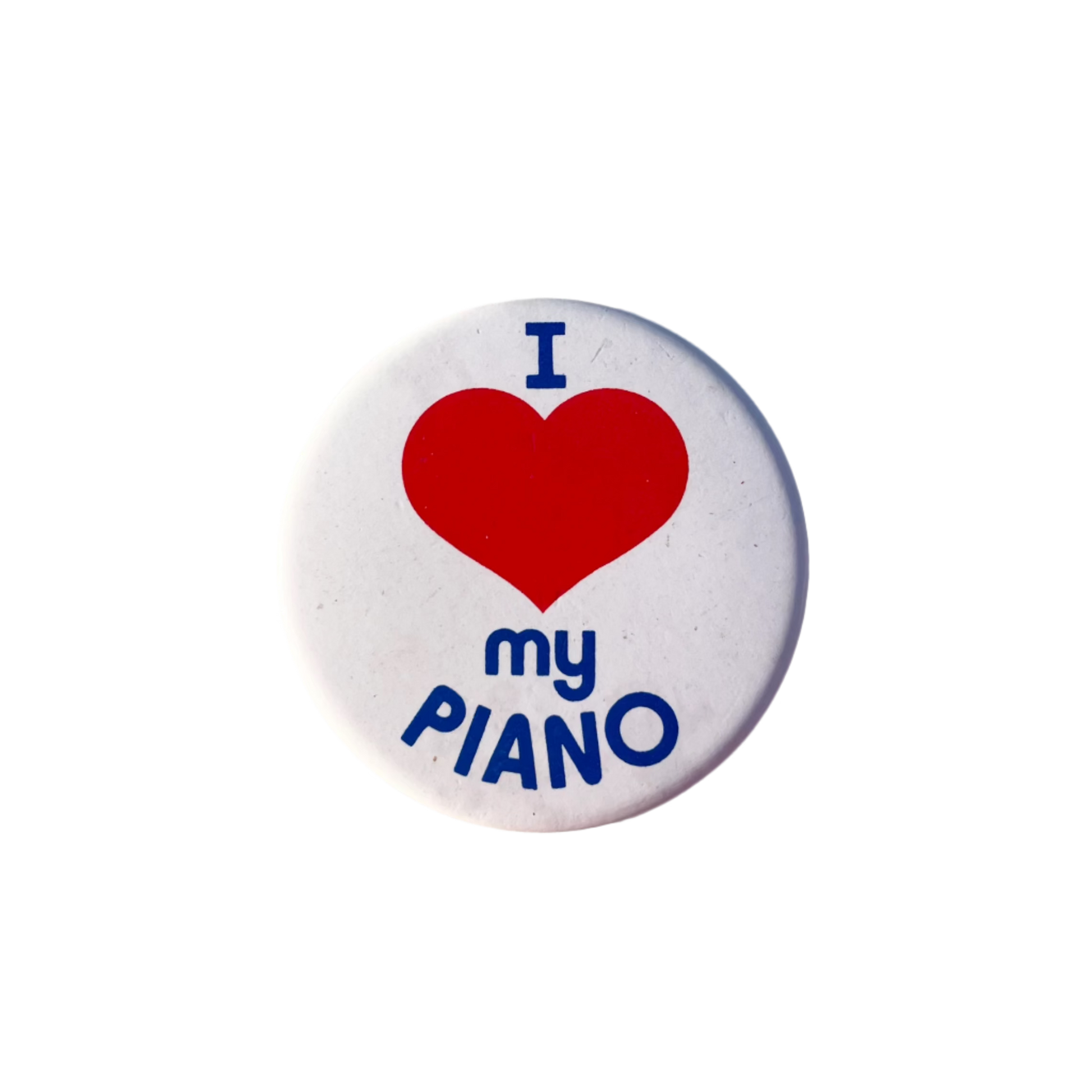 A badge with a red heart and the text 'I love my PIANO' in blue on a white background.